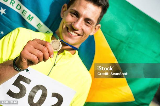 Athlete Showing Medals Stock Photo - Download Image Now - 20-24 Years, 2015, Achievement