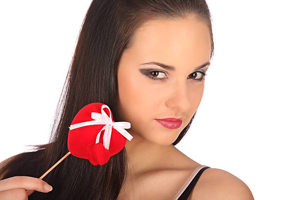 istock Valentines beauty girl with heart in her hands, studio 469450064