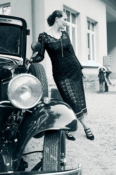 istock Woman at a Vintage Car 469455174