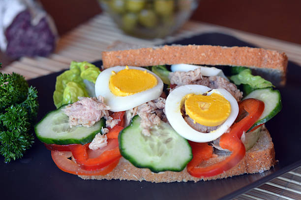 istock Rye bread sandwich with tuna fish, eggs, tomato and cucumber 469457366