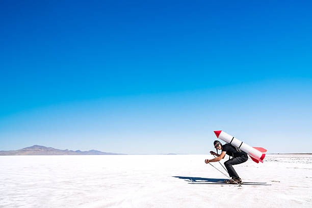 istock Skier with a rocket on his back on the desert. 469457660