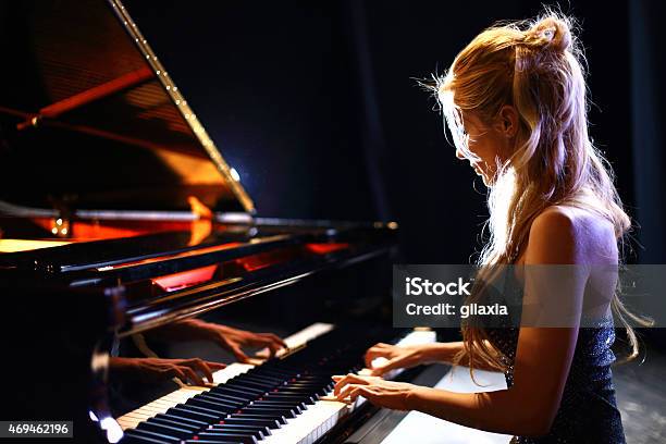 Woman Playing Piano In A Concert Stock Photo - Download Image Now - Piano, Pianist, Classical Music
