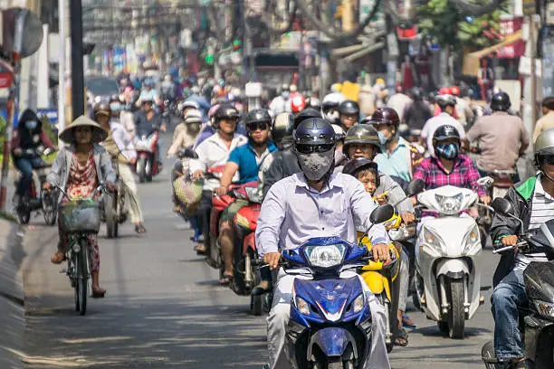 Lots of people on mopeds and scooters in Ho Chi Minh city.