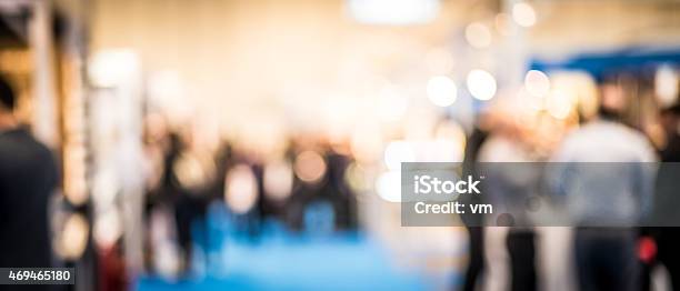 People At A Trade Exhibition Stock Photo - Download Image Now - Defocused, Meeting, Blurred Motion