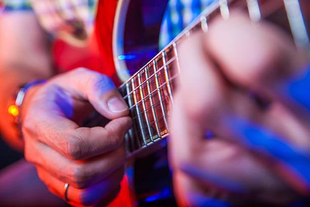 istock Male Musician with a acoustic Guitar 469465722