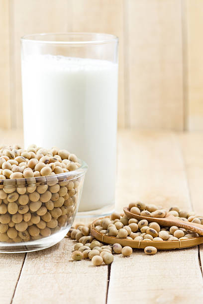 istock Soy milk and soy bean on wooden background 469470752