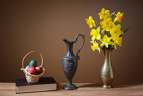 istock Easter eggs in wicker baskets and flowers 469480300