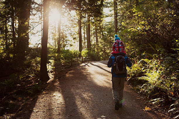 Dad and her daughter going for a beautiful walk. stock photo