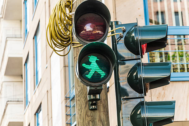 Ampelmann is the famous symbol shown on pedestrian signals Berlin, Germany - October 28, 2014: Ampelmann is the famous symbol shown on pedestrian signals in the former German Democratic Republic, now a part of Germany in Berlin, Germany. ampelmännchen photos stock pictures, royalty-free photos & images