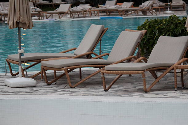 istock pool loungers by a pool 469481070
