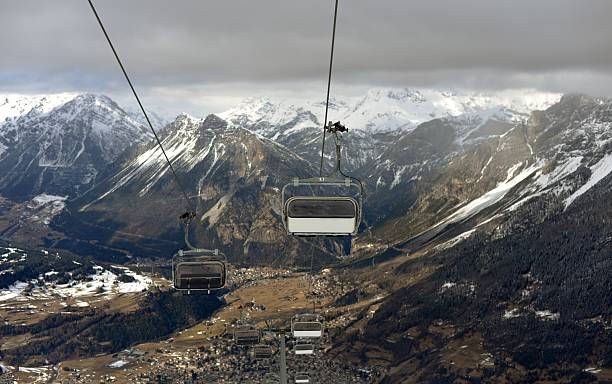 istock Chair lifts and mountain peaks 469484056