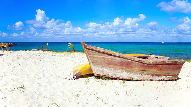 istock Small wooden boat on the beach 469488252