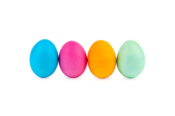 istock Standing colorful Easter eggs at line with shadows on white 469489140