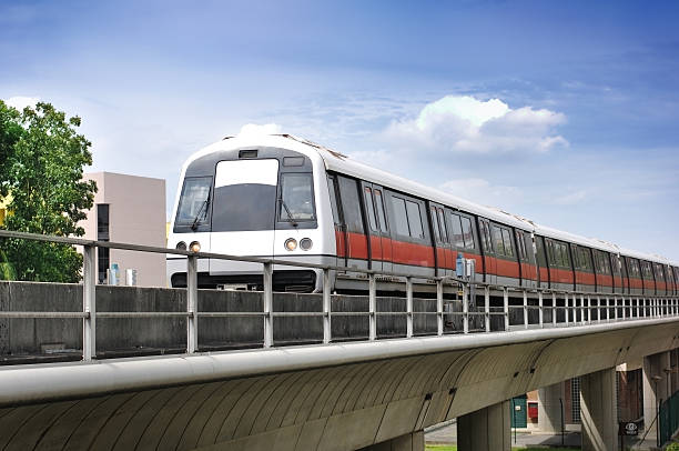 Mass Rapid Transit - Singapore MRT Train Train on the track against blue sky. singapore mrt stock pictures, royalty-free photos & images