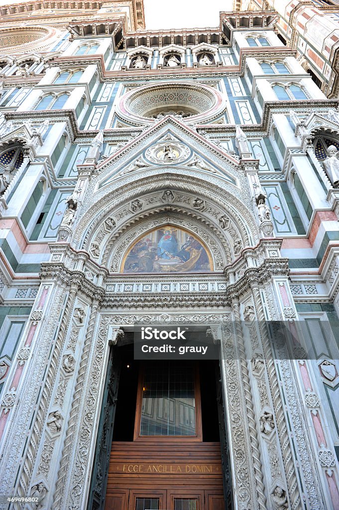 The cathedral of Florence - Tuscany The Cattedrale di Santa Maria del Fiore (English, "Cathedral of Saint Mary of the Flower") is the main church of Florence, Italy. Il Duomo di Firenze, as it is ordinarily called, was begun in 1296 in the Gothic style to the design of Arnolfo di Cambio and completed structurally in 1436 with the dome engineered by Filippo Brunelleschi. The exterior of the basilica is faced with polychrome marble panels in various shades of green and pink bordered by white and has an elaborate 19th-century Gothic Revival façade by Emilio De Fabris. Architecture Stock Photo