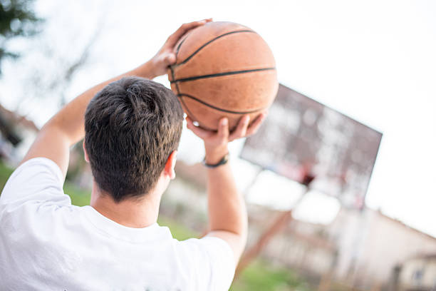 istock Man shooting at the hoop 469502620