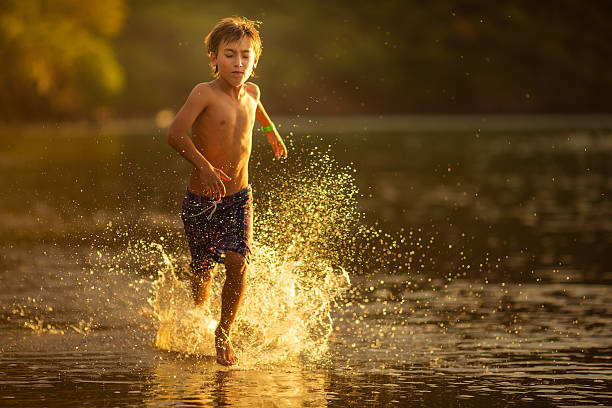 istock Kid running in the beach 469506146