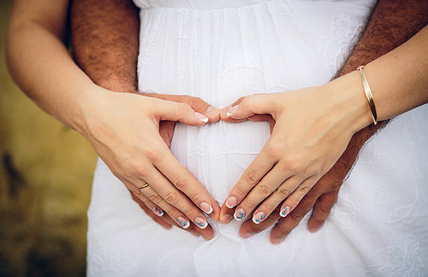 istock Husband hugging his pregnant wife 469506936