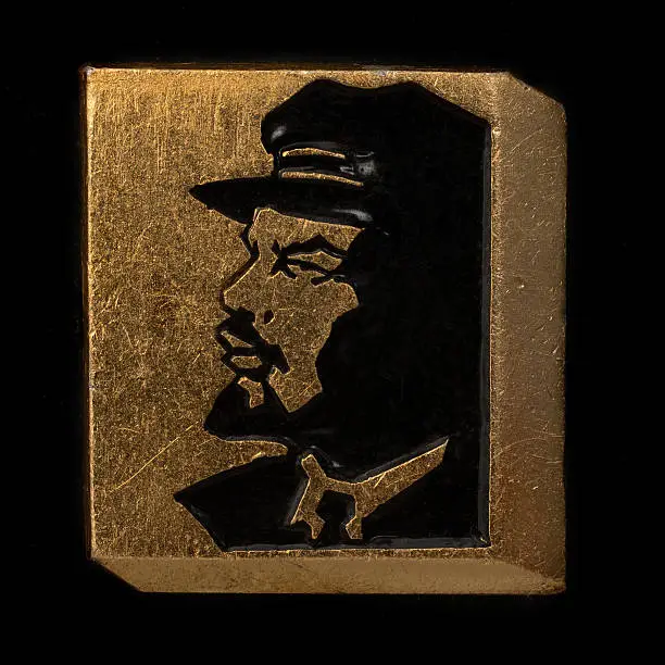 Soviet badge Lenin profile black on a gold background