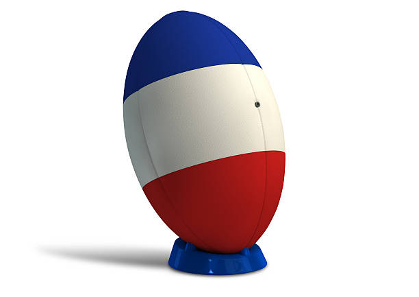 A textured rugby ball in the colors of the french national flag on a kicking tee on a isolated white background