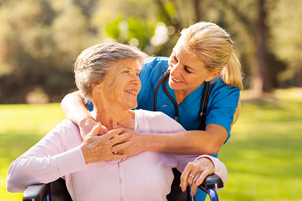 istock caring nurse with senior patient 469508261