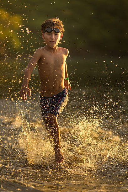istock Kid running in the beach 469510594