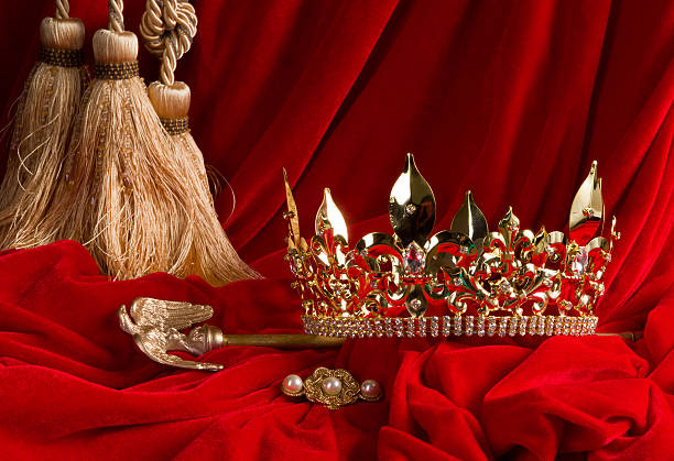 istock Crown and scepter on red velvet 469513644