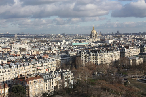 Looking out onto the city of Paris France in the late afternoon - clouds and buildings in focus.