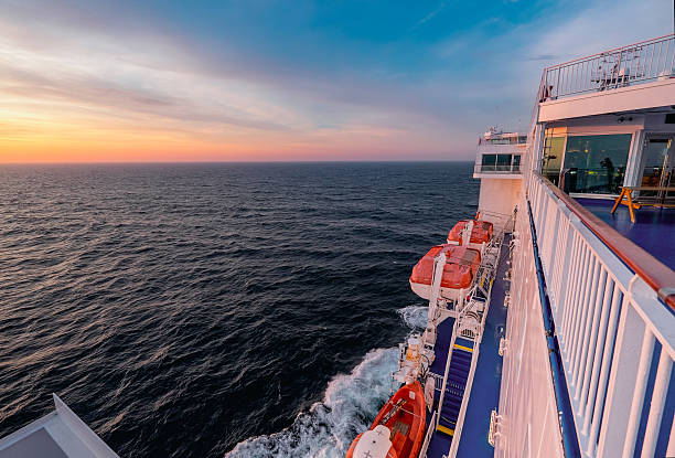 istock Cargo passenger ferry at sunset 469514544