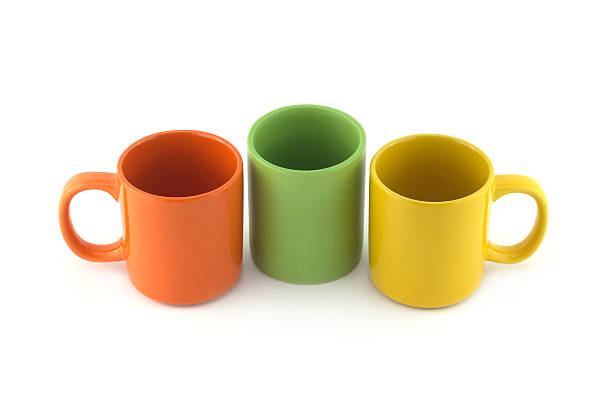 istock Three big color empty cups isolated on white close up 469517148