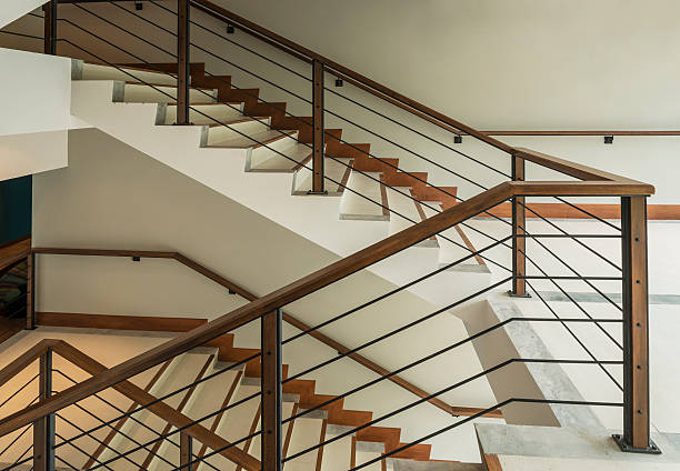 istock staircase with wooden rail in a modern building 469521062