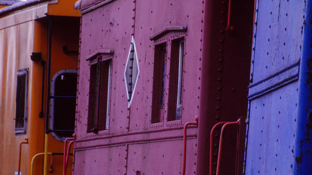 istock Three Colorful Train Boxcars 469523015