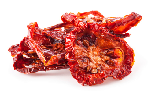 Sun dried tomatoes isolated on white background