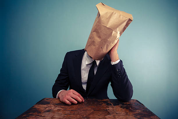 istock Sad businessman with bag over his head 469531313