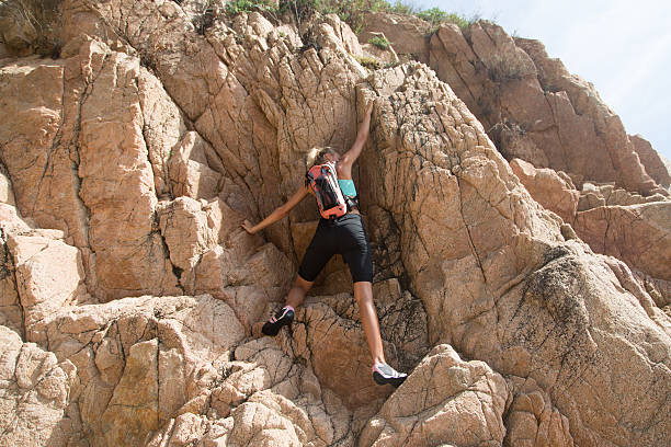istock Adventure girl on a cliff 469532474