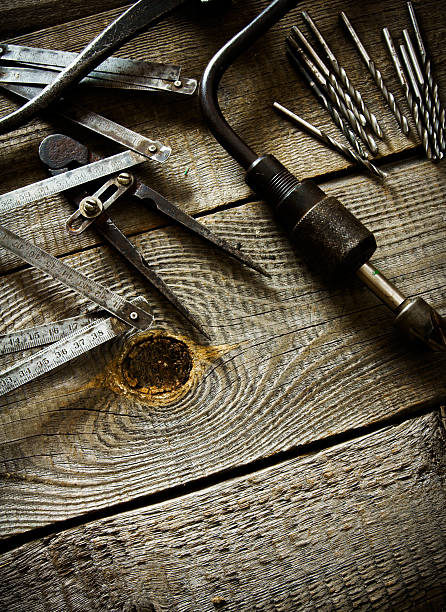 istock Old drill, compasses, ruler and drills on a wooden background 469532664