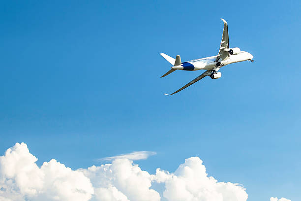 istock Airplane in the sky above the clouds. 469535046