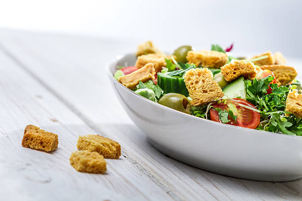 istock Close-up on a fresh Caesar salad made of vegetables 469535435