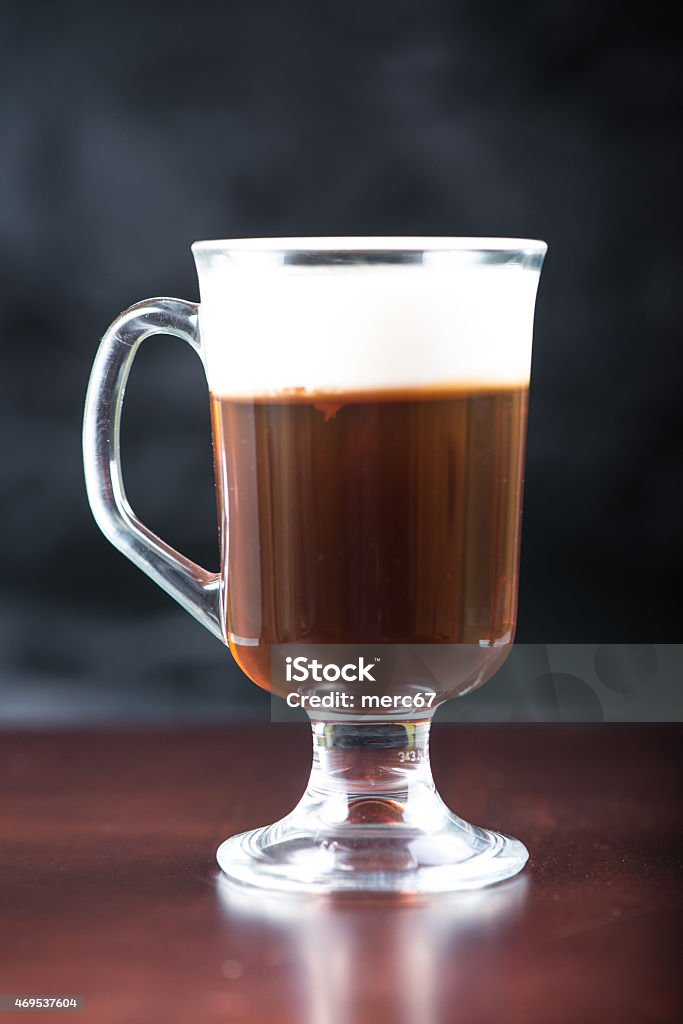 traditional strong irish coffee on wooden bar Drinking Glass Stock Photo