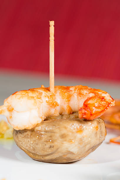 Skewer shrimp cooked with fresh mushrooms grilled