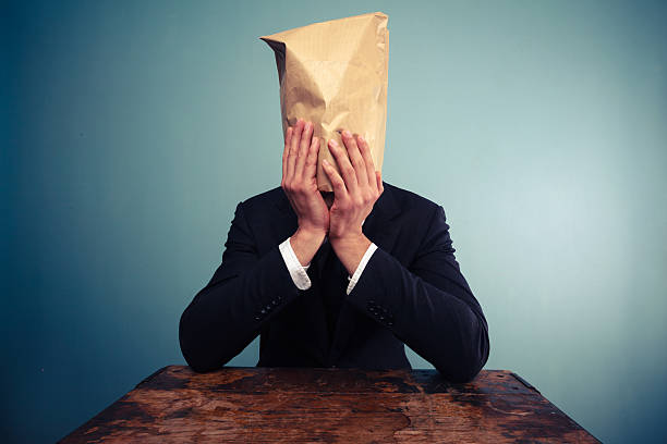 istock Upset businessman with bag over his head 469541959