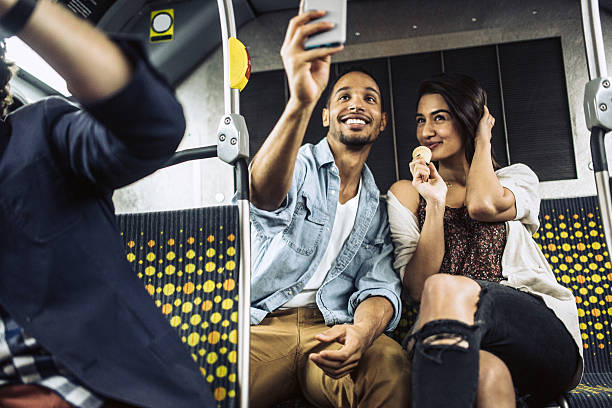 istock Couple Taking Selfie on City Metro Bus 469543570