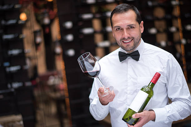 istock Man holding a glass of wine 469544098