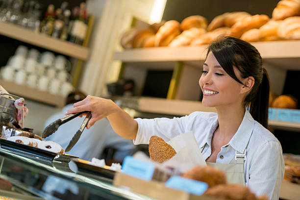 istock Woman working at a pastry shop 469544108