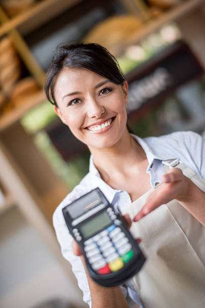 istock Waitress holding a credit card machine 469544164