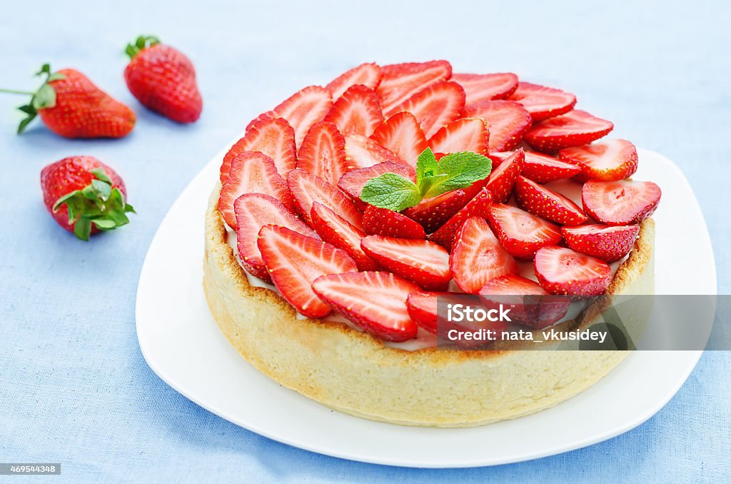 cake with strawberries and cream cheese cake with strawberries and cream cheese on a blue background. tinting. selective focus 2015 Stock Photo