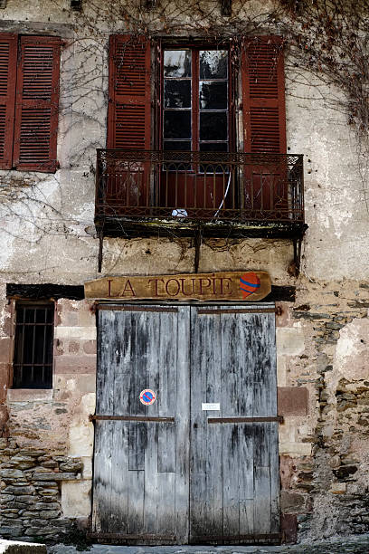 istock Garage door and window with shutters and balcony 469544524