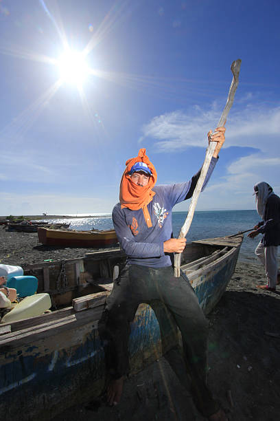Fisherman at Derrumbao Beach stock photo