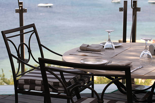 istock tablecloth, iron chairs and sea view, Greece. 469545947