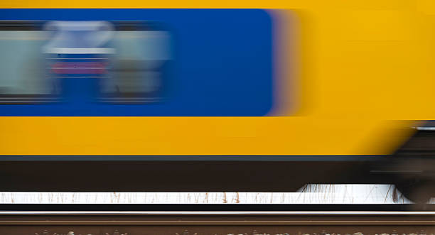 istock Train moving fast over a railroad through nature 469548576